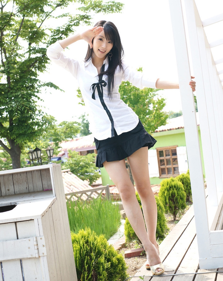 Brunette Asian Schoolgirl with Bare Legs wearing Dark Blue Pleated Miniskirt